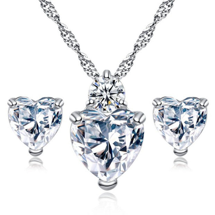 Bridal Jewelry Set Earrings Necklace featuring heart-shaped crystals in silver setting, perfect wedding accessories.