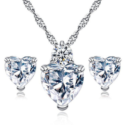 Bridal Jewelry Set Earrings Necklace featuring heart-shaped crystals in silver setting, perfect wedding accessories.